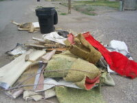 Roll up carpet and pad. bundle boards. contain trash in neat piles.